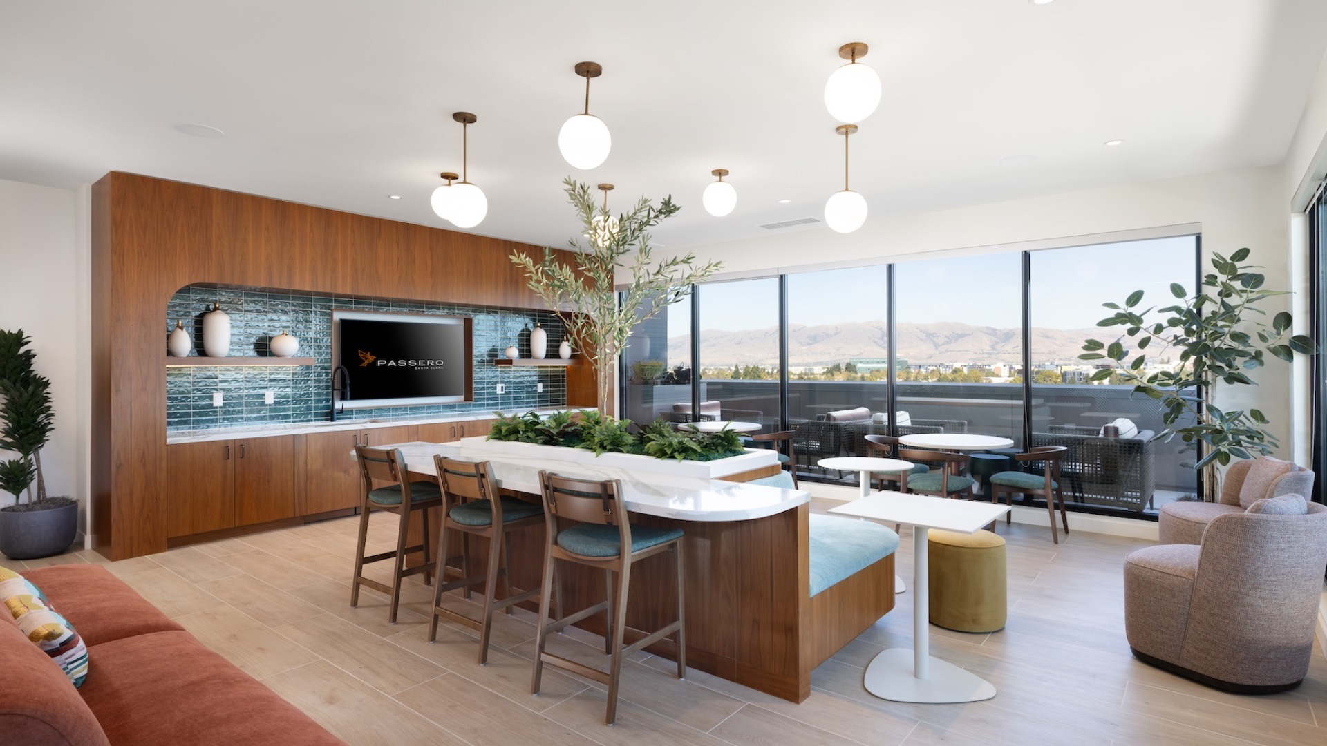 a clubroom with a tv, tables and chairs