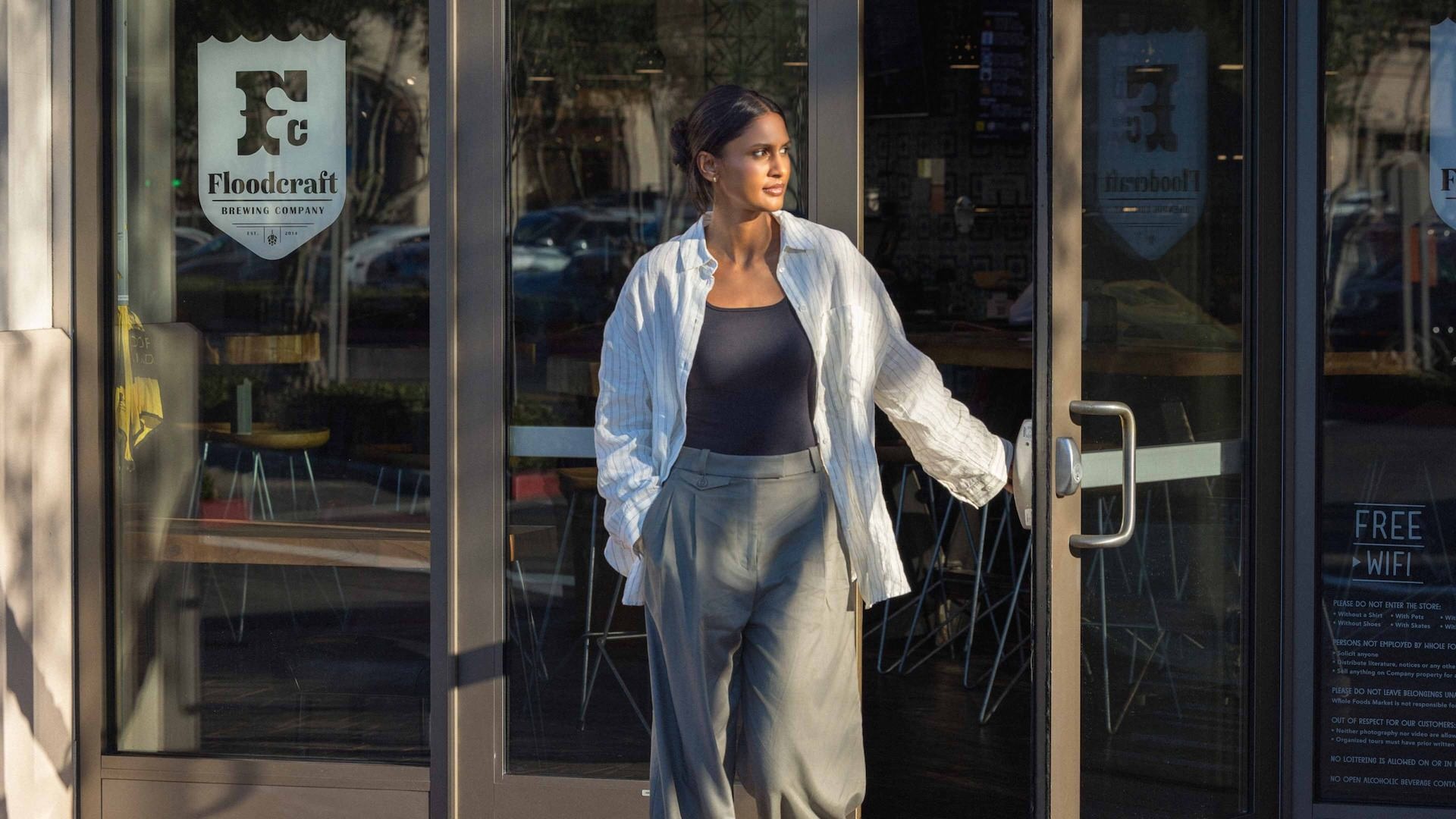 Woman walking out of a shop