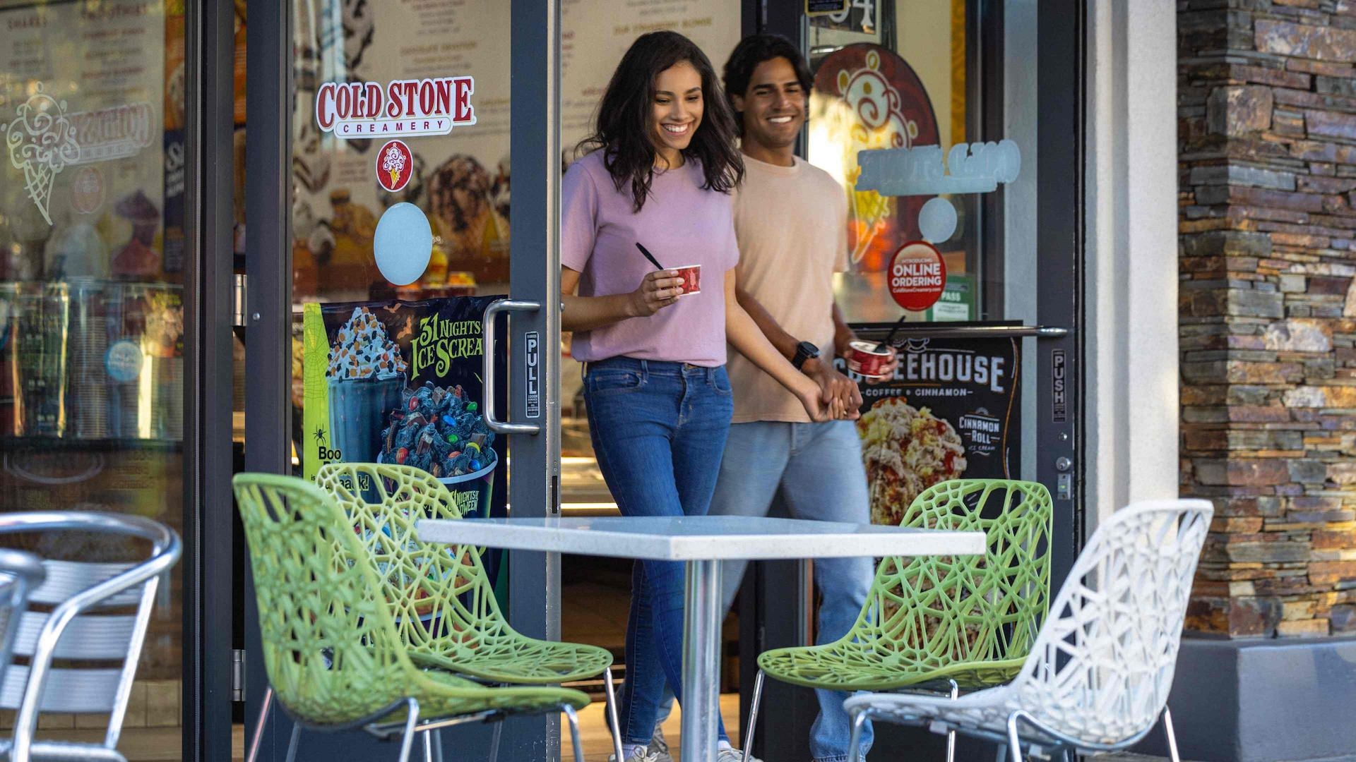 Couple walking out of a ice cream shop